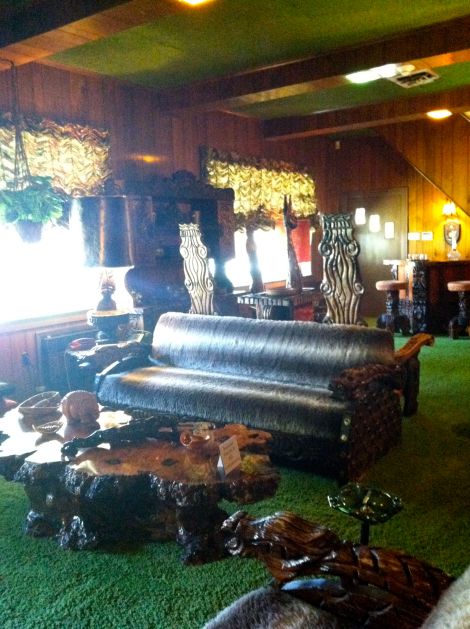 The living room, aka The Jungle Room, has a green shag ceiling (!)